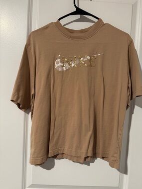 Nike Beige Tee with Gold Logo Accent